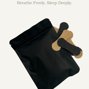 Black pillow with brown accents on a white background, featuring 'DreamBreathe' branding.
